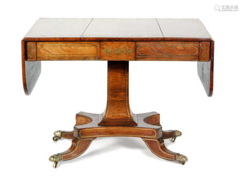 A 19th Century rosewood drop leaf sofa or centre table, with inlaid brass foliate detail, the two frieze drawers above a pedestal support and four outswept legs with applied brass castors, S/D.