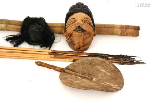 A late 19th Century skin covered quiver and arrows, a similar fan, a carved softwood mask and a replica shrunken head (qty)