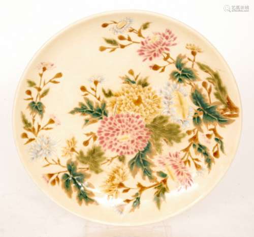 An early 20th Century Zsolnay Pecs charger decorated with sprays of flowers against a cream ground, impressed and printed mark, diameter 32.5cm, S/D