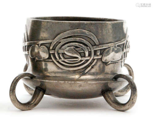 An Archibald Knox for Tudric pewter vase or fern pot, cast in low relief with stylised foliate detail and raised to four scroll feet, stamped Tudric 0288, height 7.5cm, S/D.