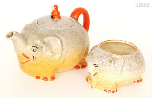 A 1930s J. Steventon & Sons Royal Venton Ware Art Deco nursery teapot and sugar bowl, both formed as elephants, the teapot finial formed as a monkey on the elephant's back, printed marks. (2)