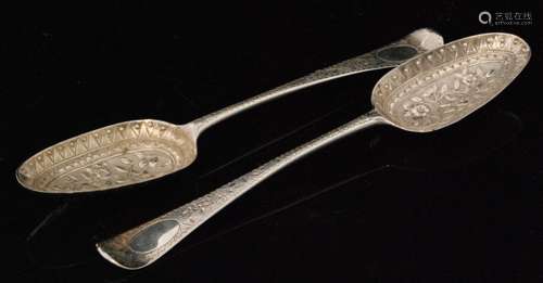 A pair of 18th Century fruit spoons, each Old English pattern with fruit embossed decoration and conforming handles, to a textured ground, bottom marked marks rubbed  (2)