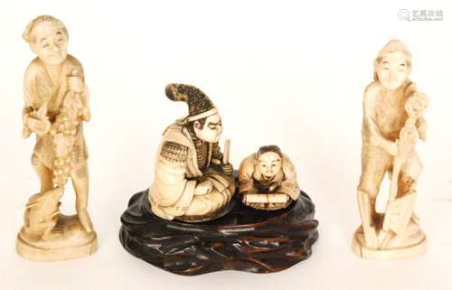 A late 19th Century Japanese carved ivory figure group of a teacher and his pupil kneeling holding a scroll, bears signature, on a carved hardwood base, together with a pair of later figures one with an axe the other with a rabbit (3)