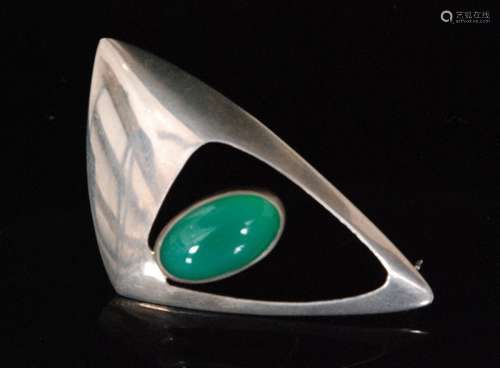 A Danish sterling silver brooch, of triangular outline the pierced frame centred by a collar set green chalcedony, stamped Sterling,  N. E. From, Denmark, London import mark for 1967