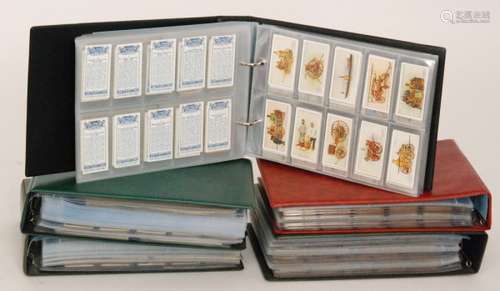 A collection of cigarette cards contained in five slip albums to include Wills military motors, speed, Lambert and Butler motorcycles, motor cars, Players motor cars and many other sets (5)