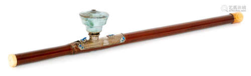 A Chinese opium pipe with bamboo stem and ivory tips, green glazed pottery bowl and silver saddle with blue enamelled frog, moths and symbols, length 55cm