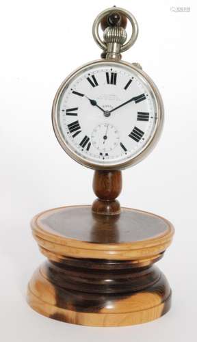 An early 20th Century Goliath plated fob watch with eight day movement  by H.C Vickery on a turned yew wood stand, height 18.5cm (2)