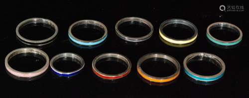 Ten assorted silver rings each with a different colour enamel decoration, various sizes, all Bernard Instone. (10).