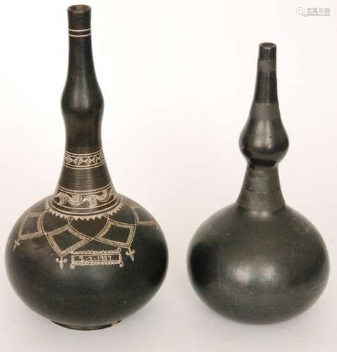 An early 20th Century African earthenware vessel of gourd form, with bands of cross hatching, height 36cm, together with a similar slightly larger example with highlighted detail and with a date cartouche for 2/7/1937, height 42cm, S/D. (2)