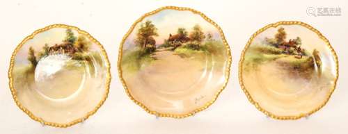 Three 1920s Royal Worcester hand painted side plates decorated by J. Hendry with a thatched country cottage, titled to the reverse Elmley, Offenham and Wick, all with puce marks and date codes for 1929, two 15cm and one 17cm