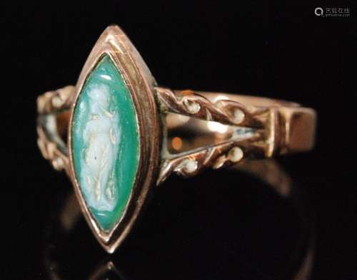 An early 20th Century 9ct rose gold cameo ring, the navette shaped green chalcedony cameo collar set to forked shoulders and plain band, Birmingham 1908, ring size O