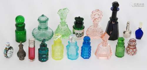 A collection of assorted scent bottles comprising a slice cut Bristol blue example, a cylinder form bottle with silver hallmarked silver mounts, a hallmarked silver globe and shaft example and other various Czech cut and moulded examples. (18)