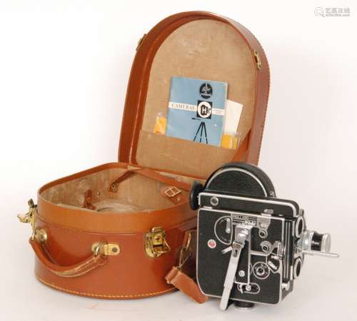 A Paillard Bolex 16mm cini camera in brown leather case with instructions.