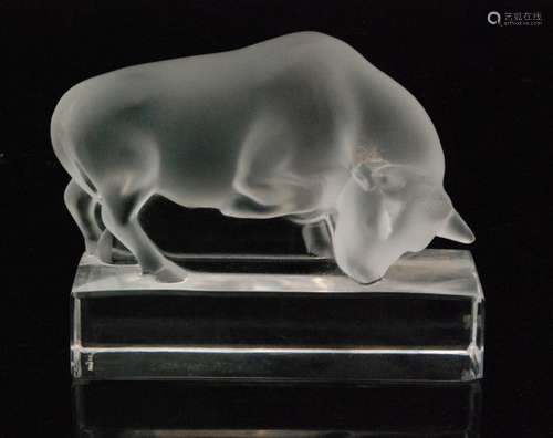 A 20th Century Lalique Taureau paperweight, the clear crystal bock rising to a figure of a bull in frosted finish, engraved signature, length 10.5cm.