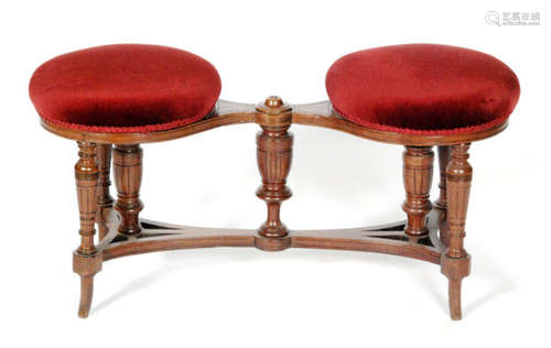 A late Victorian double circular top adjustable duet stool on splayed legs, width 92cm