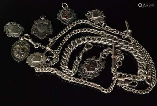 Three silver Albert watch chains each with T bar and fobs and four various silver fobs, weight 7oz (7)