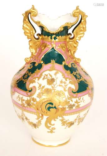 A late 19th Century Royal Crown Derby baluster vase decorated in pink green and pale yellow with a gilt overlay pattern and moulded scroll handles, printed mark with date code for 1897, height 19cm