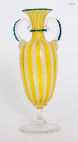 An early 20th Century Italian Murano glass vase in the manner of Salviati, of footed amphora form the body decorated with alternate Zanfirico and yellow canne bands with applied clear crystal handles and blue trim, unmarked, height 22cm.