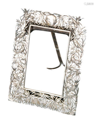 A Chinese silver rectangular frame with pierced and embossed border decoration of birds amongst bamboo branches and foliage, height 19cm x width 15cm, stamped MK 88