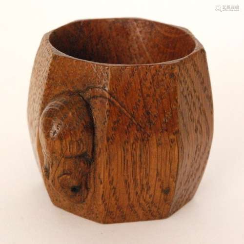 A Robert 'Mouseman' Thompson oak octagonal napkin ring, with carved mouse signature, height 5cm