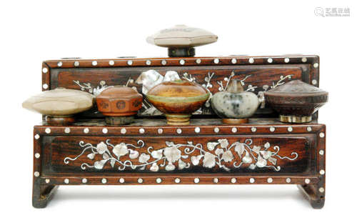 A Chinese hardwood opium table opium bowl stand of stepped form inlaid with mother of pearl floral decoration, together with six opium bowls including moss agate example, width 27.5cm (7)