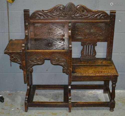 A Victorian carved oak combination hall bench with shaped lozenge detail back on block legs and stretchers, width 108cm