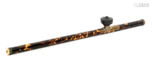 A Chinese opium pipe with tortoiseshell overlaid bamboo stem, brass saddle, black terracotta bowl and coloured enamelled collars to both ends, length 58cm