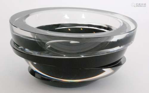 A contemporary Rosenthal Studio Line glass bowl of slice cut construction in a black and clear crystal palette, acid marked, diameter 20cm.