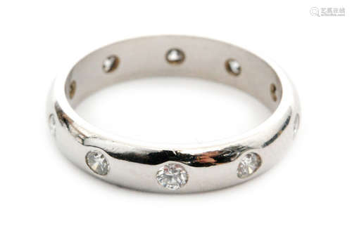 A platinum and diamond set D shaped wedding band, the plain band inset with ten round brilliant cut diamonds, ring size L