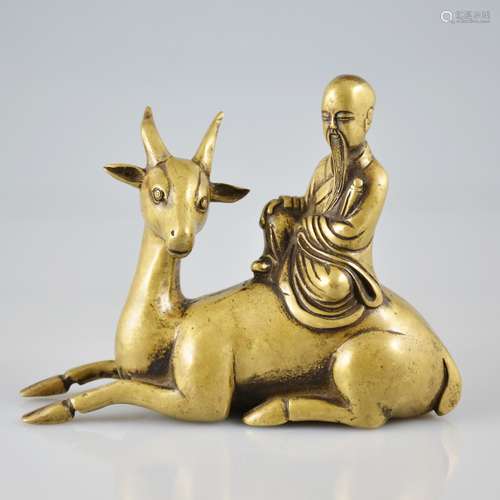 A Bronze Figure of Immortal Riding a Deer