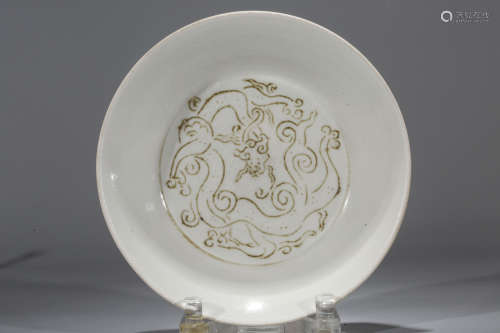 Chinese Ding ware plate with dragon decoration.