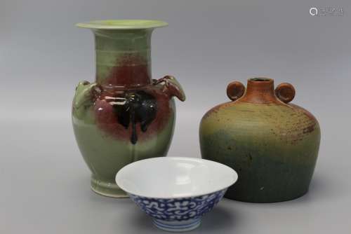 Group of decorative porcelain and pottery items.