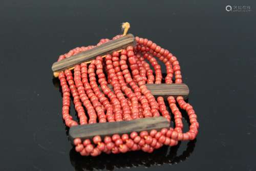 Red beads bracelet.