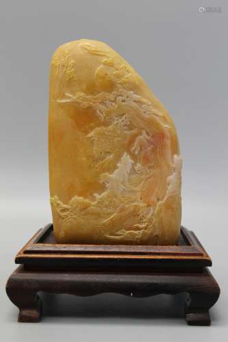 Chinese carved yellow stone with wood stand.