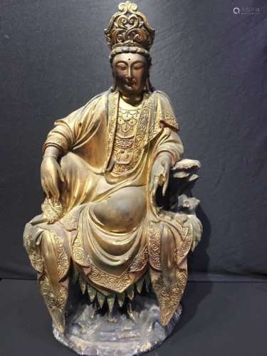 A ZHANG WOOD CARVING OF GUANYIN