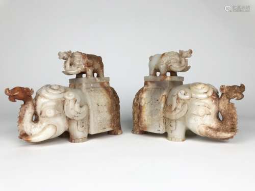 A PAIR OF JADE CARVED ELEPHANTS AND COVERS