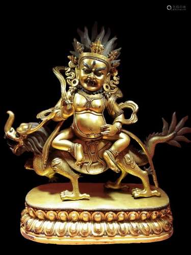 A GILT-BRONZ FIGURE OF WHITE JAMBHALA