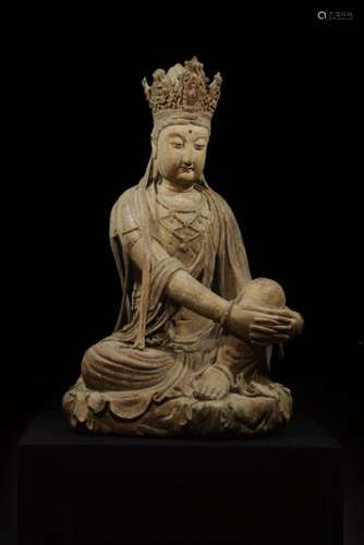 A WOODEN FIGURE OF GUANYIN