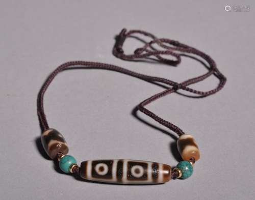 A TIBET GZI NECKLACE.