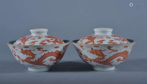 A PAIR OF IRON-RED DRAGON BOWL AND COVERS. Period of QianLong.