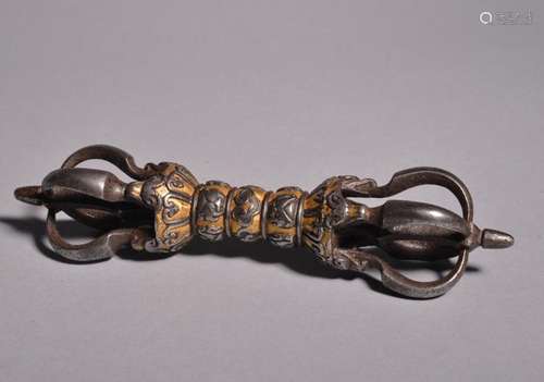 AN IRON GOLD-SILVER-COPPER-INLAID VAJRA. Ming Dynasty