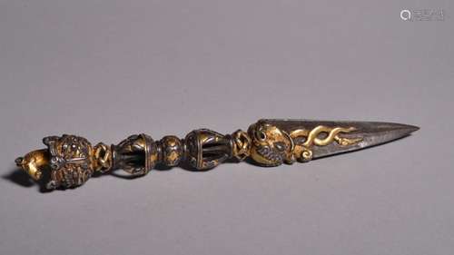 AN IRON GOLD-SILVER-COPPER-INLAID PHURPA. Ming Dynasty