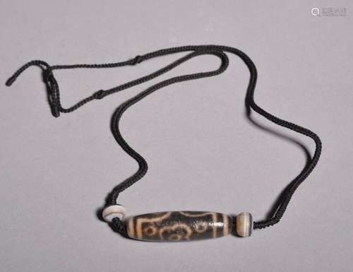 A TIBET GZI NECKLACE.