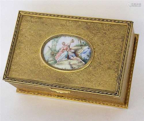 A JEWELLERY BOX Gilt brass with floral relief on