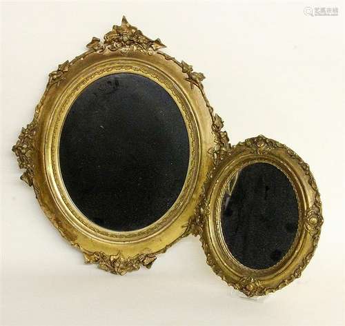 TWO WALL MIRRORS 19th century In oval, gilt