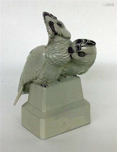 A PARAKEET PAIR Grey glazed porcelain with brown