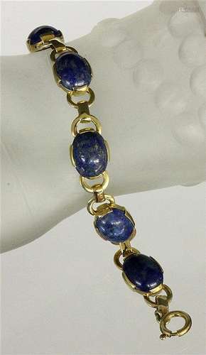 A BRACELET Gilt silver with lapis lazuli. Gross