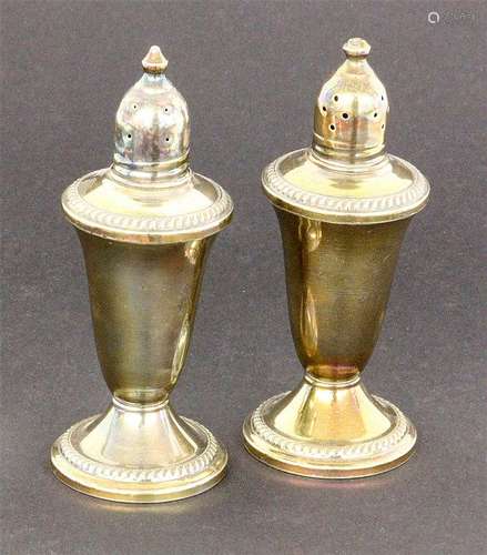 A PAIR OF SILVER SALT AND PEPPER SHAKERS USA