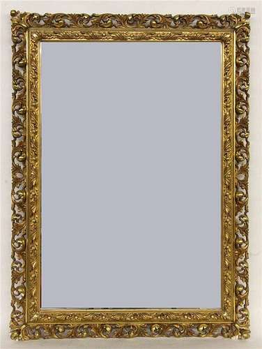 A BAROQUE STYLE WALL MIRROR circa 1900 Gilded