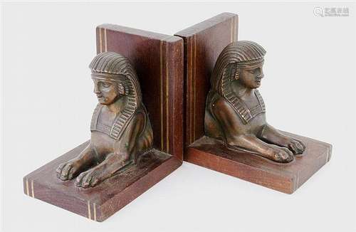 A PAIR OF SPHINGES AS BOOKENDS Bronzed metal